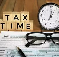 tax time and eye glass